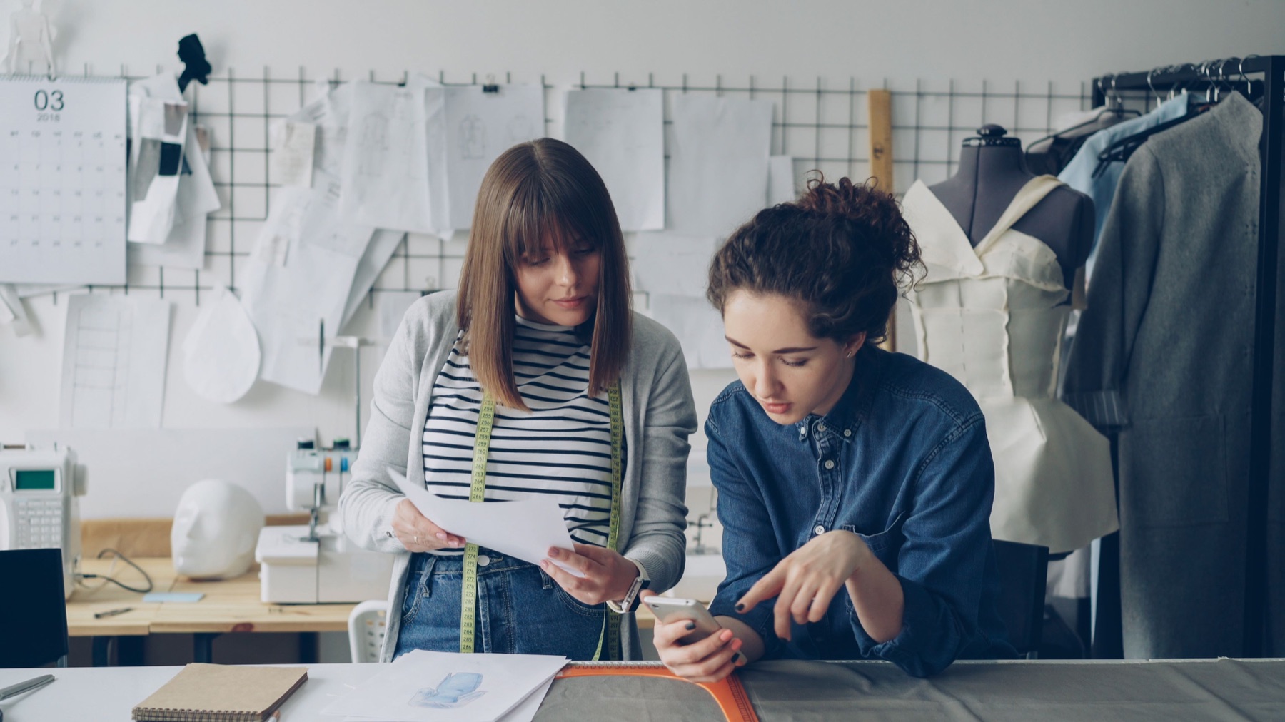 Designers reviewing work inside a fashion studio